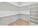 Spacious walk-in closet with custom shelving and ample storage space at 128 Owens Mill Pl, Canton, GA 30115