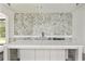 Close-up of wet bar with white countertops, patterned backsplash, and island in a flex room with slate flooring at 128 Owens Mill Pl, Canton, GA 30115