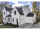 Charming home featuring a two-car garage, beautiful front yard, and crisp white paint at 128 Owens Mill Pl, Canton, GA 30115