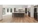 Bright, open kitchen with large island, stainless steel appliances, and ample storage space at 128 Owens Mill Pl, Canton, GA 30115