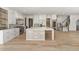 Bright, open kitchen with a large island, stainless steel appliances, and custom cabinetry at 128 Owens Mill Pl, Canton, GA 30115