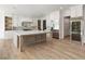 Gourmet kitchen featuring a large island, stainless steel appliances, and custom cabinetry at 128 Owens Mill Pl, Canton, GA 30115