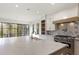 Bright kitchen with a large island, custom cabinets, designer backsplash, and stainless appliances at 128 Owens Mill Pl, Canton, GA 30115