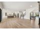 Expansive living room open to the kitchen, featuring hardwood floors and plenty of room at 128 Owens Mill Pl, Canton, GA 30115