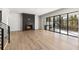 Spacious living room with a fireplace, and access to a covered back porch at 128 Owens Mill Pl, Canton, GA 30115