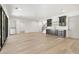 Bright living room with light hardwood floors, black-framed windows and a convenient wet bar for entertaining at 128 Owens Mill Pl, Canton, GA 30115
