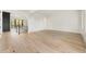 Open-concept living room with hardwood floors, fireplace, and natural light at 128 Owens Mill Pl, Canton, GA 30115