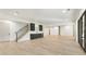 Large bonus room with wet bar, wood floors, staircase, and steel and glass doors leading to outside at 128 Owens Mill Pl, Canton, GA 30115