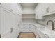 Walk-in pantry features custom cabinets, drawers, counter space, and shelving at 128 Owens Mill Pl, Canton, GA 30115