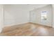 Bright room with hardwood floors, two windows, and classic trimwork at 128 Owens Mill Pl, Canton, GA 30115