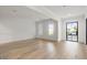 Bright, open room with hardwood floors and large windows at 128 Owens Mill Pl, Canton, GA 30115