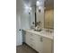 Bright bathroom with a double vanity, modern lighting, and stylish neutral-colored cabinets at 1919 Repose Dr, Chamblee, GA 30341