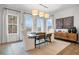 Bright dining room featuring a modern chandelier, a dining table, and a built-in sideboard at 1919 Repose Dr, Chamblee, GA 30341
