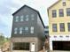 Modern home featuring a brick foundation and a sleek gray exterior at 1919 Repose Dr, Chamblee, GA 30341