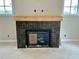 Elegant fireplace with a tiled surround and rustic wooden mantel at 1919 Repose Dr, Chamblee, GA 30341