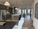 Open-concept kitchen with stainless steel appliances, modern cabinetry, and ample counter space at 1919 Repose Dr, Chamblee, GA 30341