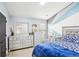 Charming bedroom with a silver dresser, crib and an accent wall with a modern design at 2248 Newbury Oaks Dr, Lawrenceville, GA 30044