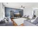 Stylish living room showcases a modern wall design, gray sofas, natural light, and an open layout at 2248 Newbury Oaks Dr, Lawrenceville, GA 30044