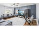 Stylish living room featuring a modern wall design, comfortable seating, and ample natural light at 2248 Newbury Oaks Dr, Lawrenceville, GA 30044