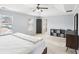 Bright main bedroom with large windows, paneled door, trey ceiling, and a combination dresser at 2248 Newbury Oaks Dr, Lawrenceville, GA 30044