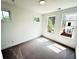 Bright bedroom with carpet flooring and natural light from three windows at 2410 Edgar Park Pl # 104, Duluth, GA 30096
