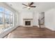 Bright living room boasts hardwood floors, ceiling fan and fireplace at 2410 Edgar Park Pl # 104, Duluth, GA 30096