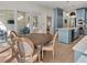 Breakfast nook with a wooden table and chairs with views of the screened outdoor patio at 582 Lakeshore Ne Dr, Atlanta, GA 30307