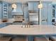 Stylish blue kitchen featuring a spacious island and modern appliances at 582 Lakeshore Ne Dr, Atlanta, GA 30307