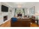Cozy living room with hardwood floors, fireplace, and stylish decor at 582 Lakeshore Ne Dr, Atlanta, GA 30307