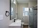 Modern bathroom featuring a sleek vanity, updated fixtures, and a glass enclosed shower at 984 Cascade Sw Rd, Atlanta, GA 30311