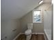 Bathroom featuring a toilet, tub, shower and window at 984 Cascade Sw Rd, Atlanta, GA 30311