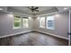Spacious bedroom with large windows, hardwood floors, recessed lighting, and ceiling fan at 984 Cascade Sw Rd, Atlanta, GA 30311