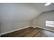 Image shows the bedroom with new floors, neutral paint, and a window at 984 Cascade Sw Rd, Atlanta, GA 30311