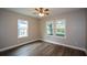 Bedroom with windows, a ceiling fan, and wood-look flooring at 984 Cascade Sw Rd, Atlanta, GA 30311