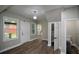 Welcoming foyer featuring modern lighting and a view leading into the kitchen at 984 Cascade Sw Rd, Atlanta, GA 30311