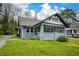 Charming single-story home featuring a screened-in front porch and a freshly painted exterior at 984 Cascade Sw Rd, Atlanta, GA 30311