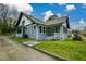 Charming home featuring beautiful architecture, screened in porch, and mature landscaping at 984 Cascade Sw Rd, Atlanta, GA 30311