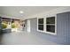 Spacious screened front porch with neutral paint and multiple access points at 984 Cascade Sw Rd, Atlanta, GA 30311