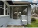 Inviting screened-in front porch with classic brick columns and neutral paint at 984 Cascade Sw Rd, Atlanta, GA 30311