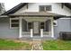 Inviting front porch featuring white railings and blue brick exterior at 984 Cascade Sw Rd, Atlanta, GA 30311