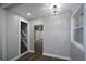 Hallway with wood-look floors and decorative lighting at 984 Cascade Sw Rd, Atlanta, GA 30311