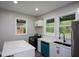 Well-lit kitchen featuring stainless steel appliances, bright white countertops and a garden view at 984 Cascade Sw Rd, Atlanta, GA 30311