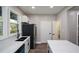 Bright kitchen featuring stainless steel appliances, bright white countertops and ample storage at 984 Cascade Sw Rd, Atlanta, GA 30311