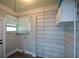 Laundry room features a window for natural light and white walls and cabinetry at 984 Cascade Sw Rd, Atlanta, GA 30311