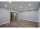 Spacious living room featuring recessed lighting, neutral walls, and new floors at 984 Cascade Sw Rd, Atlanta, GA 30311