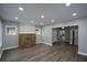 Bright living room with modern flooring, fireplace, and plenty of natural light at 984 Cascade Sw Rd, Atlanta, GA 30311