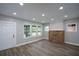 Bright living room boasts a decorative brick fireplace and large windows for ample natural light at 984 Cascade Sw Rd, Atlanta, GA 30311