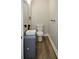 This powder room features a vessel sink, wood-look floor, and modern fixtures at 984 Cascade Sw Rd, Atlanta, GA 30311