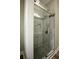 Elegant tiled shower showcasing a modern design, glass door and updated fixtures at 984 Cascade Sw Rd, Atlanta, GA 30311