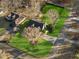 Aerial view of a well maintained lawn and mature trees surrounding this lovely home at 1206 Red Fox Cir, Woodstock, GA 30188